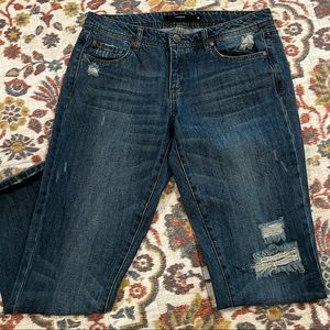 Distressed dark washed ankle cropped jeans